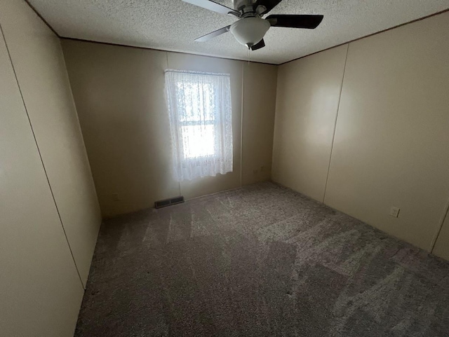 521 Oak Lodge Rd, Waterford, WI 53185 - unfurnished room featuring carpet flooring, a textured ceiling, and ceiling fan