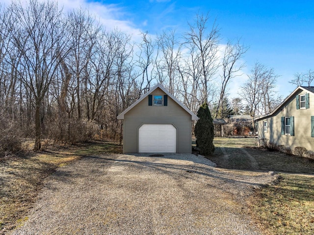 view of side of property with a garage and an outdoor structure