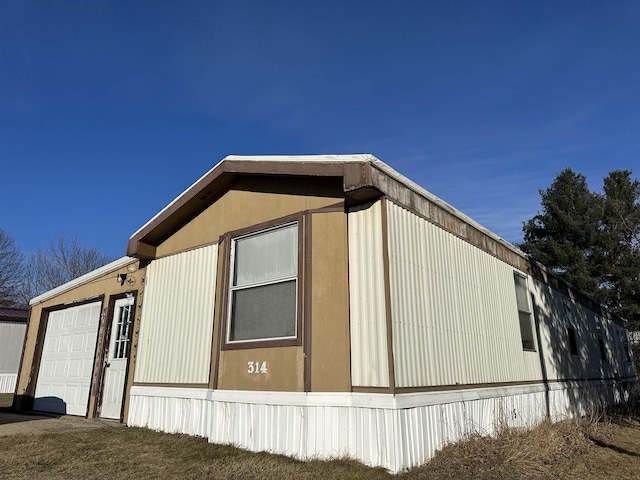 view of side of home featuring a garage