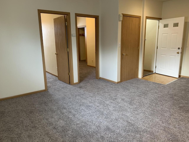 unfurnished bedroom featuring light carpet