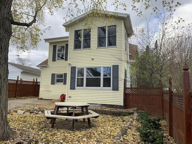 back of property featuring a patio