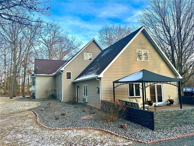 back of house with a gazebo and a patio