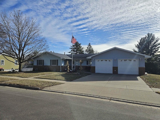 ranch-style house featuring a garage