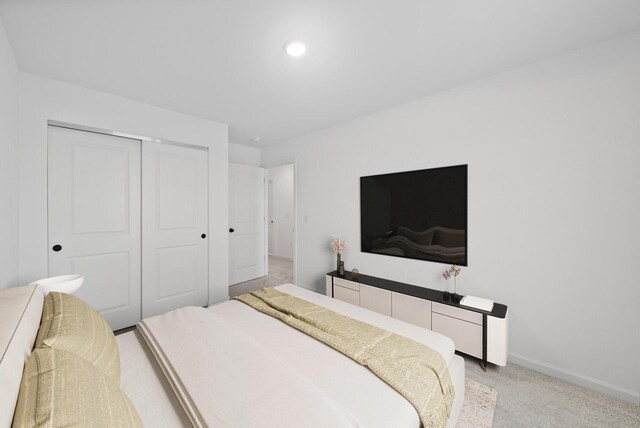 carpeted bedroom with a closet
