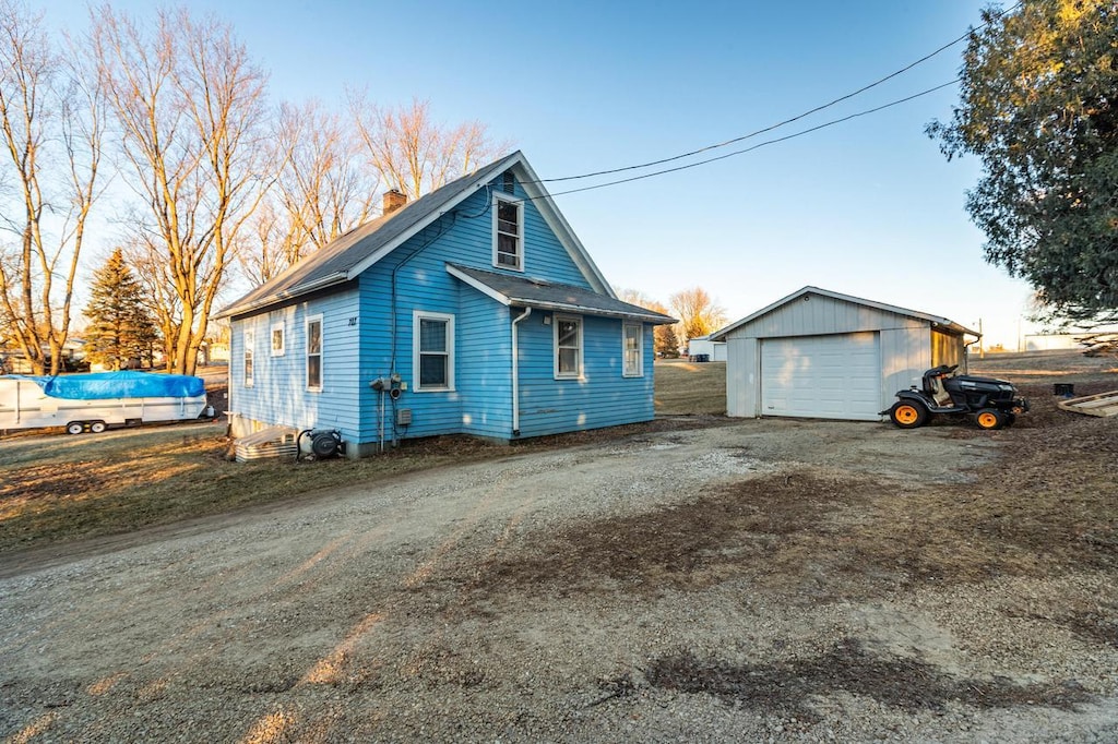 view of front of property featuring an outbuilding and a garage