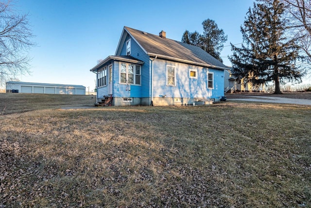 view of property exterior with a lawn