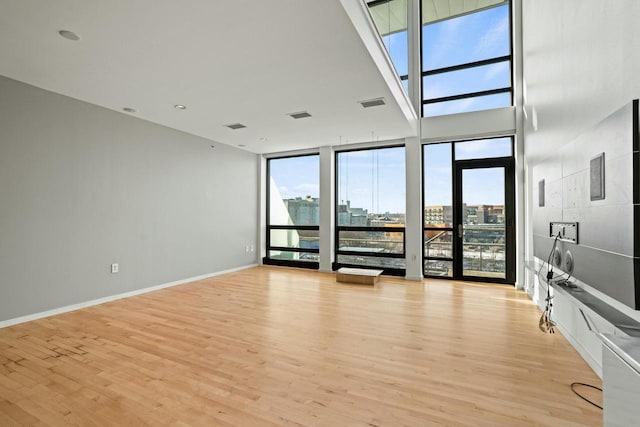 unfurnished living room with light hardwood / wood-style flooring