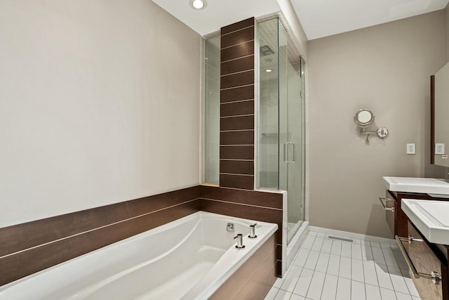 bathroom with tile patterned floors, vanity, and separate shower and tub