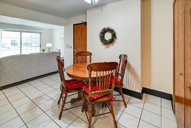 dining space with light tile patterned floors