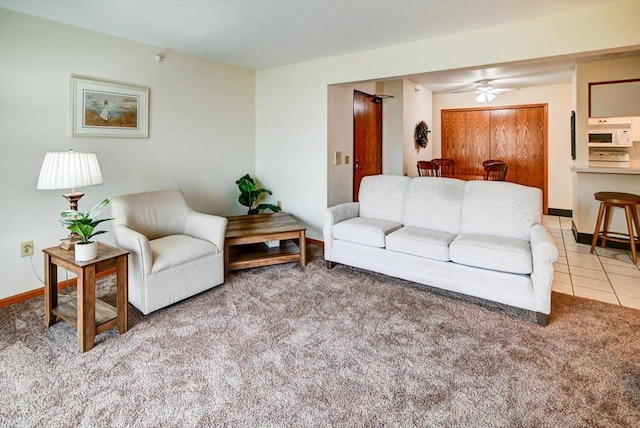 tiled living room featuring ceiling fan