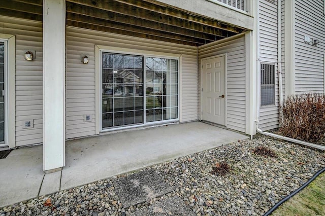 doorway to property with a patio