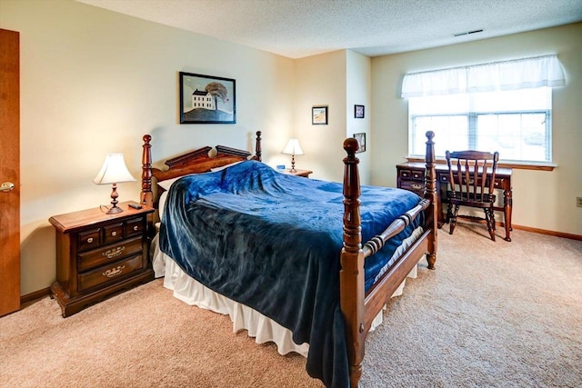 carpeted bedroom featuring a textured ceiling