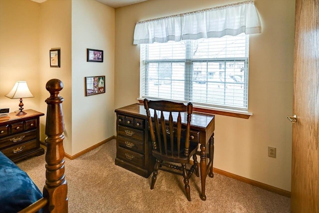 office area featuring light carpet