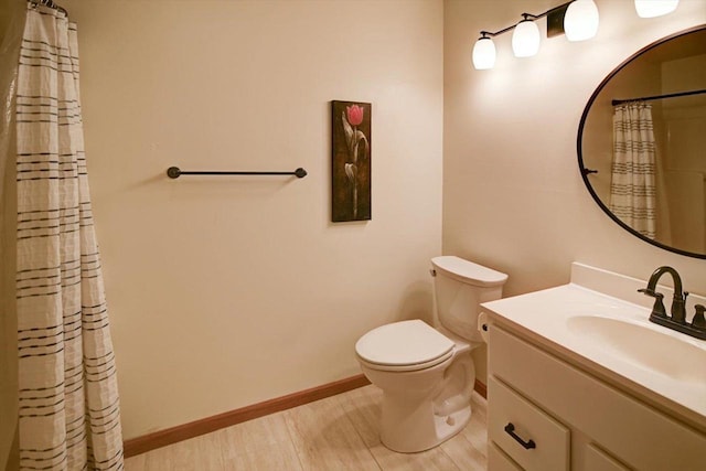 bathroom with walk in shower, vanity, wood-type flooring, and toilet