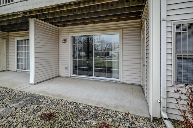 doorway to property with a patio area