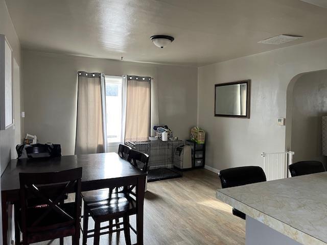 dining area with light hardwood / wood-style floors