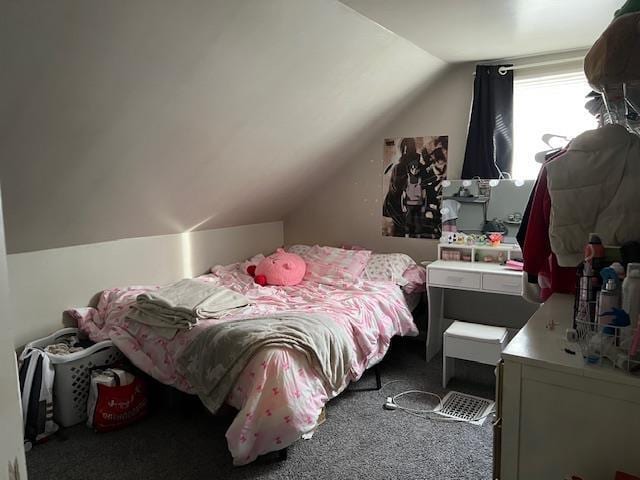 carpeted bedroom with vaulted ceiling