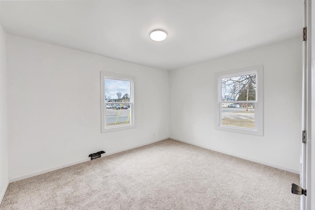 unfurnished room with carpet flooring