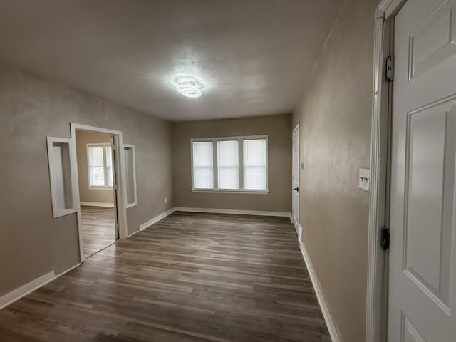 spare room featuring dark hardwood / wood-style flooring