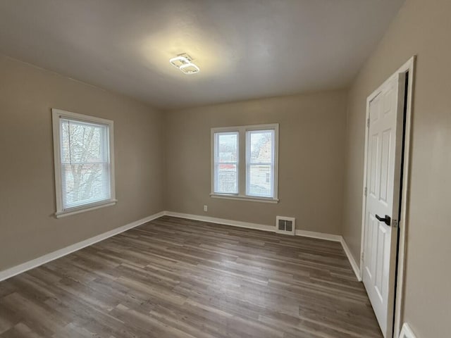 empty room featuring dark hardwood / wood-style floors