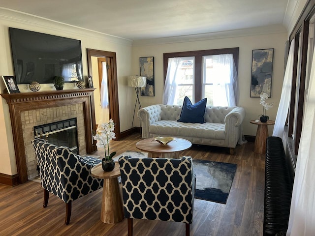 living room with dark hardwood / wood-style flooring, ornamental molding, and a fireplace