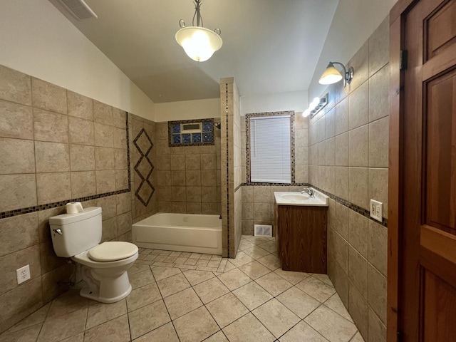 full bathroom featuring tile patterned flooring, vanity, toilet, and tile walls