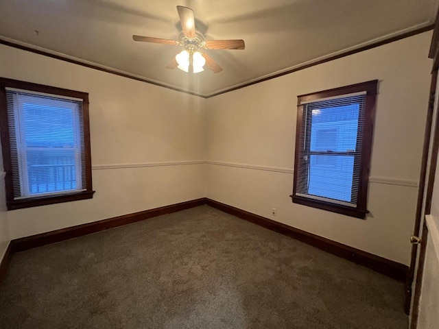 carpeted empty room featuring ceiling fan