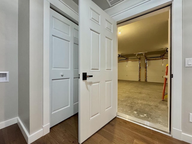 corridor featuring wood-type flooring