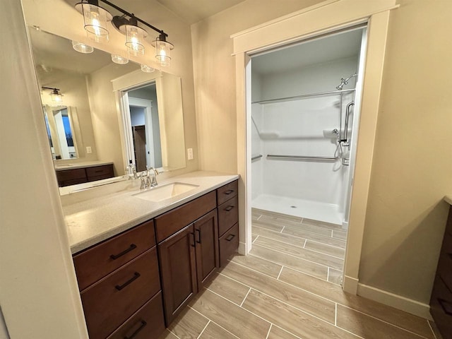 bathroom with vanity and walk in shower