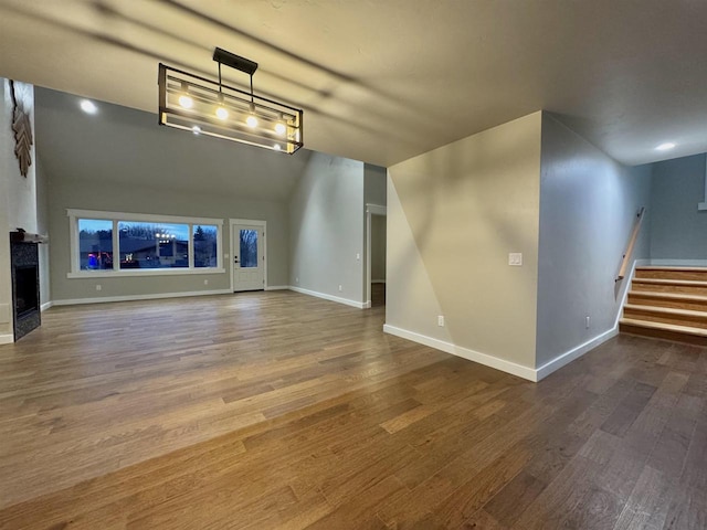 unfurnished living room with wood-type flooring