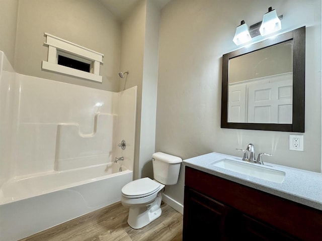 full bathroom with vanity, wood-type flooring,  shower combination, and toilet