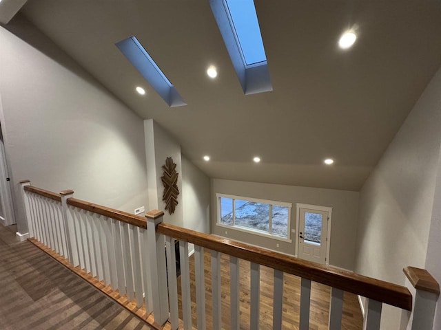 interior space featuring carpet and lofted ceiling with skylight