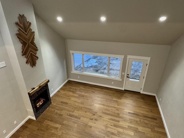 unfurnished living room featuring hardwood / wood-style flooring