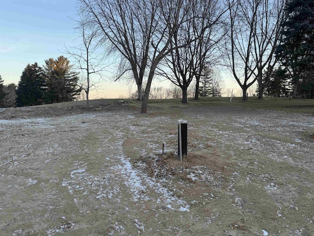 view of yard at dusk