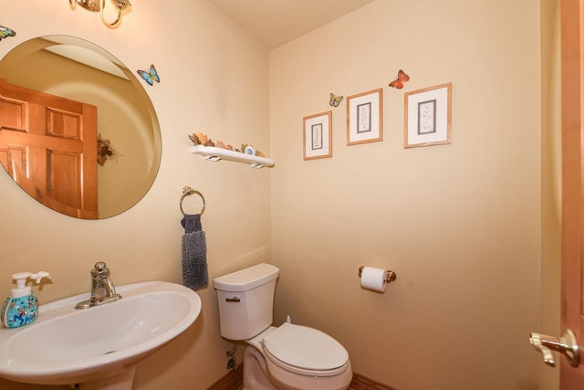 bathroom with toilet and sink