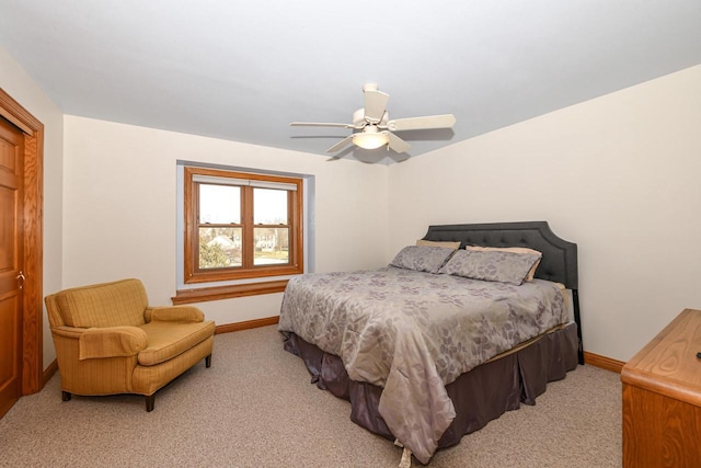 bedroom featuring ceiling fan and light carpet