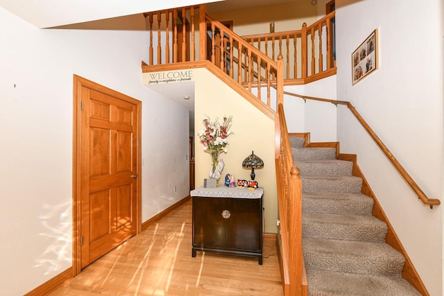 staircase featuring hardwood / wood-style flooring