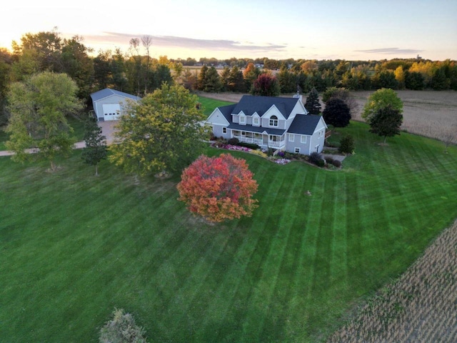 aerial view at dusk featuring a rural view