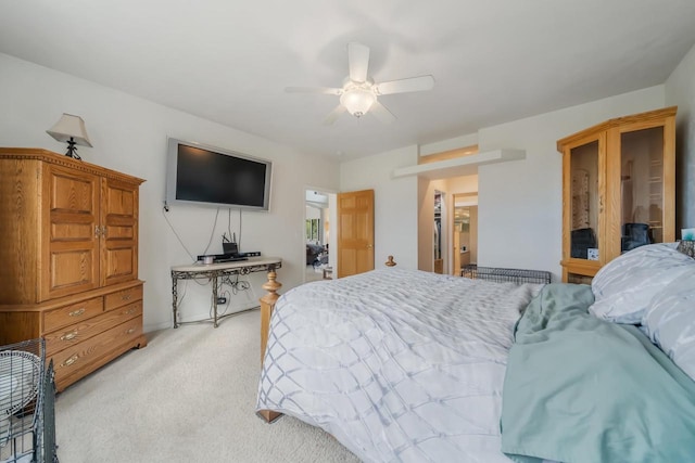 carpeted bedroom with ceiling fan and a closet