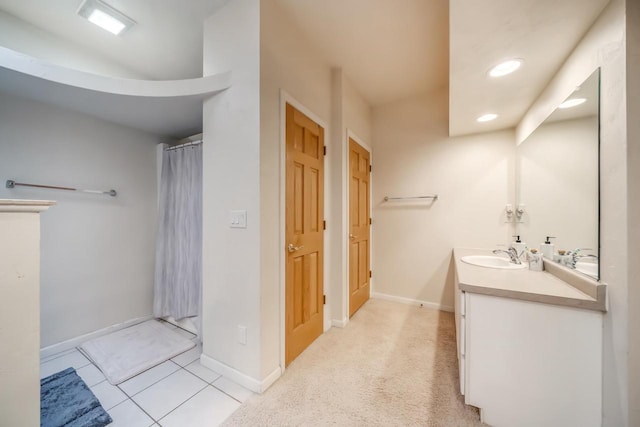 bathroom featuring tile patterned flooring and vanity