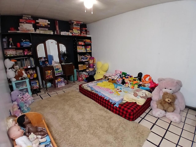 bedroom with light tile patterned floors