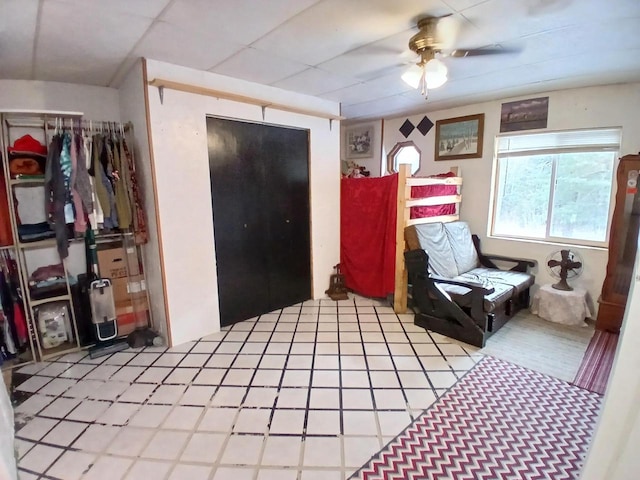 living area featuring ceiling fan