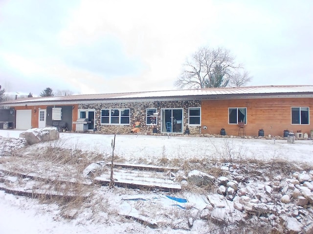 view of snow covered house