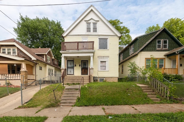 view of front of home featuring a balcony and a porch