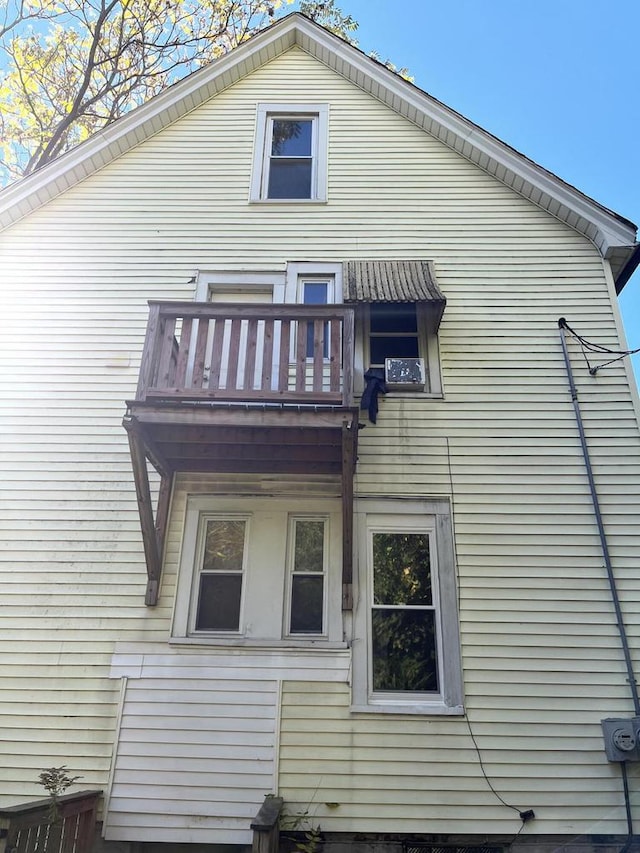 back of house with a balcony