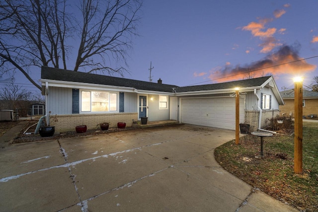 single story home featuring a garage