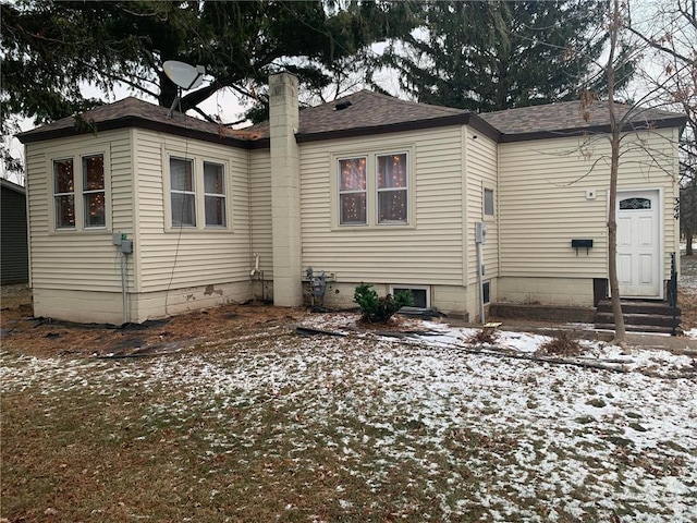 view of snow covered house