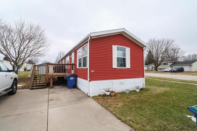 view of property exterior featuring a yard and a wooden deck