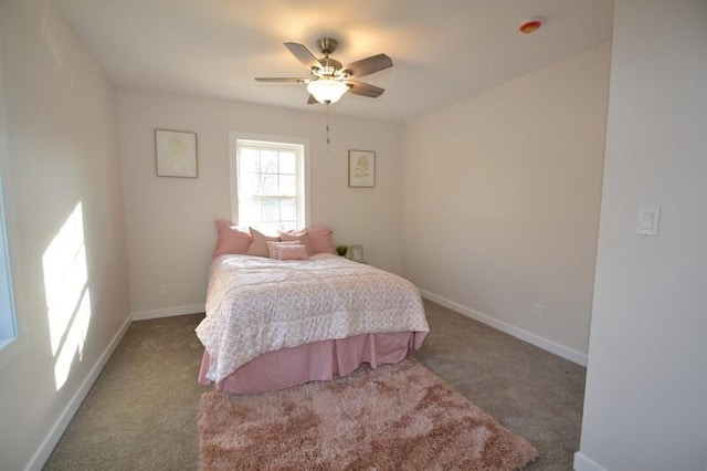 bedroom featuring dark colored carpet and ceiling fan