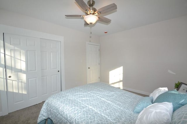 carpeted bedroom featuring a closet and ceiling fan